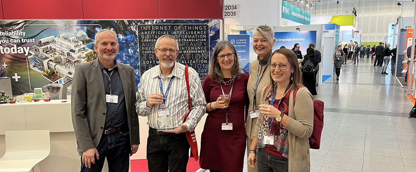 STAR employees in front of the STAR Deutschland exhibition stand.